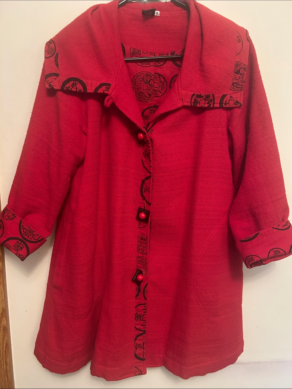 Unique red jacket from Thailand with graffiti